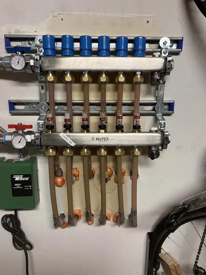 Plumber performing Water Heater Repair at a residential property in Dover